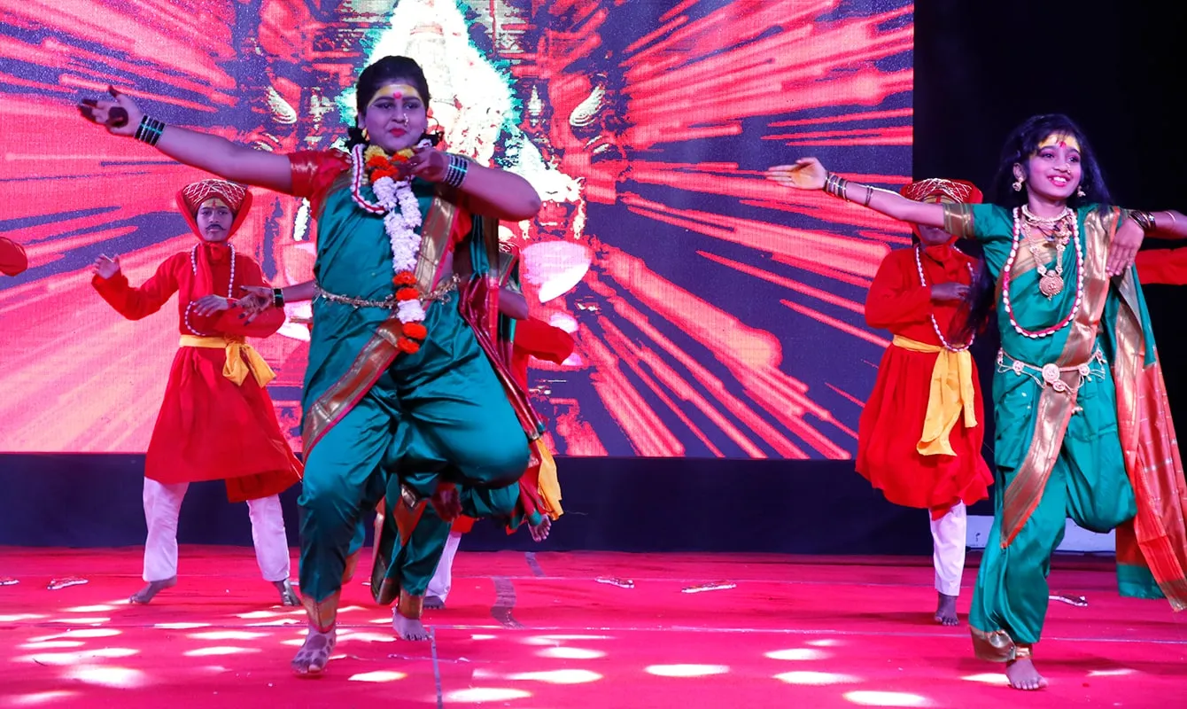 Students performing a Lavani dance on stage