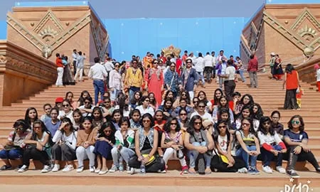 A large group of students on the steps of a historic monument